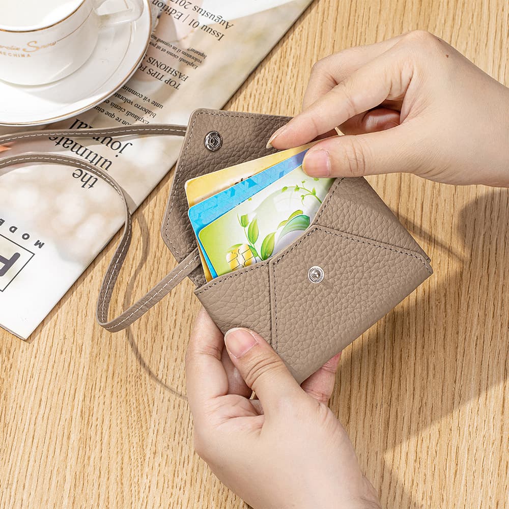 Crossbody envelope shaped solid color leather card bag