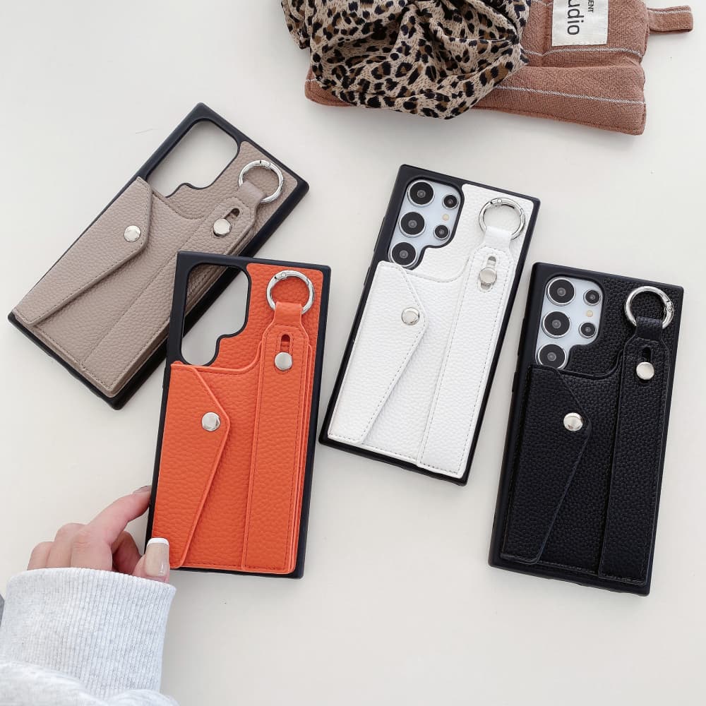 Solid color lychee patterned wristband flip style card slot phone case