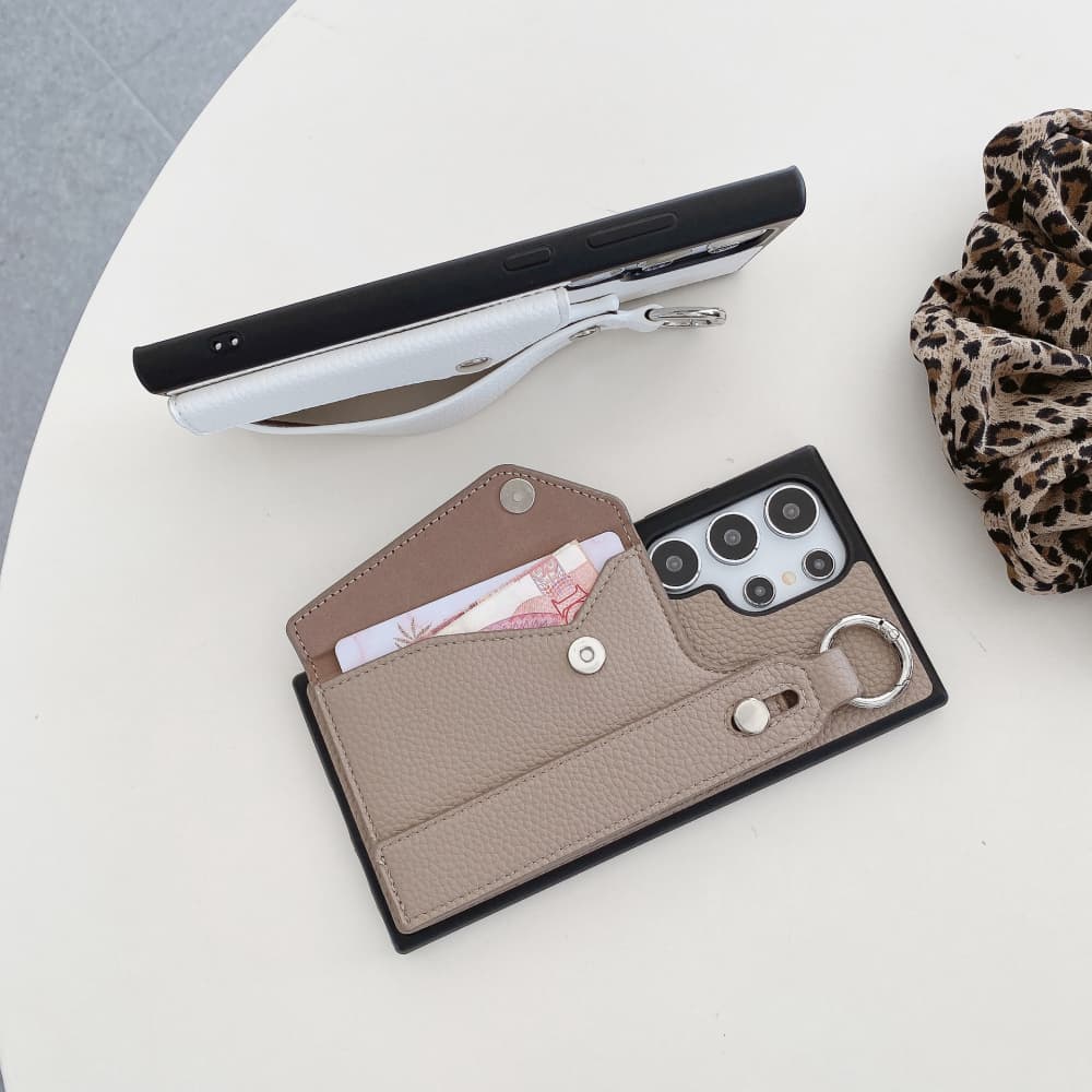 Solid color lychee patterned wristband flip style card slot phone case