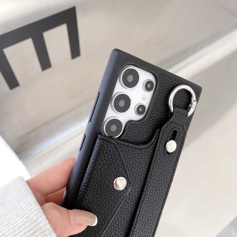 Solid color lychee patterned wristband flip style card slot phone case