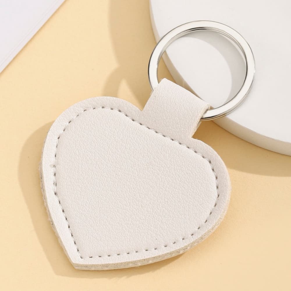 Solid color PU leather heart-shaped silver buckle keychain